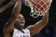 Kansas guard Andrew Wiggins dunks during the second half of an NCAA college basketball game against Oklahoma State in the quarterfinals of the Big 12 Conference men's tournament in Kansas City, Mo., Thursday, March 13, 2014. Kansas defeated Oklahoma State 77-70 in overtime. (AP Photo/Orlin Wagner)