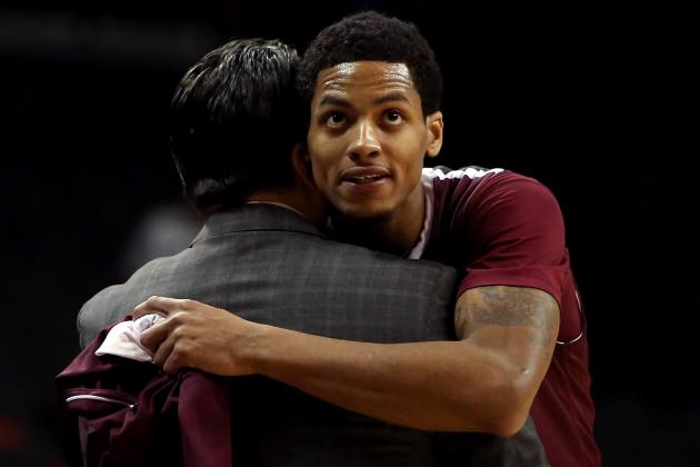 NEW YORK, NY - MARCH 13: Branden Frazier #0 of the Fordham Rams hugs head coach Tom Pecora as he comes out of the game late in the second half against the Dayton Flyers in the Second Round of the 2014 Atlantic 10 Men's Basketball Tournament at Barclays Center on March 13, 2014 in the Brooklyn Borough of New York City.  (Photo by Mike Lawrie/Getty Images)