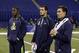 Texas A&M quarterback Johnny Manziel, right, Fresno State quarterback Derek Carr, center, and Louisville quarterback Teddy Bridgewater watch drills at the NFL football scouting combine in Indianapolis, Sunday, Feb. 23, 2014. (AP Photo/Michael Conroy)