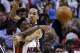 Miami Heat guard Norris Cole (30) passes past Brooklyn Nets guard Shaun Livingston, rear, during the second half of an NBA basketball game, Wednesday, March 12, 2014 in Miami. The Nets defeated the Heat 96-95. (AP Photo/Wilfredo Lee)