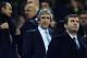 Manchester City's manager Manuel Pellegrini, center, on the stands, waits for the start of the Champions League, round of 16, second leg, soccer match between FC Barcelona and Manchester City at the Camp Nou Stadium in Barcelona, Spain, Wednesday March 12, 2014. (AP Photo/Manu Fernandez)
