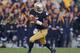 SOUTH BEND, IN - NOVEMBER 17: Everett Golson #5 of the Notre Dame Fighting Irish rolls out against the Wake Forest Demon Deacons at Notre Dame Stadium on November 17, 2012 in South Bend, Indiana. Notre Dame defeated Wake Forest 38-0. (Photo by Jonathan Daniel/Getty Images)