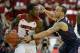 Mar 8, 2014; Louisville, KY, USA; Connecticut Huskies guard Shabazz Napier (13) pressures Louisville Cardinals guard Chris Jones (3) during the first half at KFC Yum! Center. Mandatory Credit: Jamie Rhodes-USA TODAY Sports