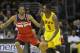 Cleveland Cavaliers' Luol Deng (9), from Sudan, goes against Washington Wizards' Trevor Ariza (1) in an NBA basketball game Sunday, Feb. 23, 2014, in Cleveland. (AP Photo/Mark Duncan)
