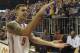 Florida guard Scottie Wilbekin (5) does the gator chomp as he leaves the court after Florida defeated LSU 79-61 in an NCAA college basketball game Saturday, March 1, 2014 in Gainesville, Fla. (AP Photo/Phil Sandlin)