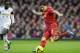 Liverpool's Luis Suarez keeps the ball from Swansea City's Nathan Dyer during their English Premier League soccer match at Anfield Stadium, Liverpool, England, Sunday Feb. 23, 2014. (AP Photo/Jon Super)