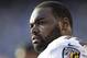 In this Nov. 25, 2012 photo, Baltimore Ravens tackle Michael Oher sits on the sidelines during the second half of an NFL football game against the San Diego Chargers, in San Diego. Oher and his adoptive family were depicted in the book and movie,