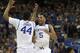 Kentucky guard Andrew Harrison (5) and Kentucky center Dakari Johnson (44) celebrate in the closing moments of the second half of an NCAA college basketball game against Georgia in the semifinal round of the Southeastern Conference men's tournament, Saturday, March 15, 2014, in Atlanta. Kentucky won 70-58. (AP Photo/John Bazemore)
