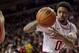 Arkansas' Rashad Madden passes the ball during the first half an NCAA college basketball game against Auburn in Fayetteville, Ark., Wednesday, Jan. 16, 2013. (AP Photo/Gareth Patterson)