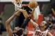 Chicago Bulls center Joakim Noah, right, blocks a shot by Sacramento Kings forward Jason Thompson during the second half of an NBA basketball game in Chicago on Saturday, March 15, 2014. The Bulls won 94-87. (AP Photo/Nam Y. Huh)
