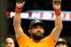 Johny Hendricks celebrates after beating Robbie Lawler during a UFC 171 mixed martial arts welterweight title bout, Saturday, March 15, 2014, in Dallas. Hendricks won by decision. (AP Photo/Matt Strasen)