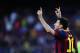FC Barcelona's Lionel Messi, celebrates after scoring during the Spanish La Liga soccer match between FC Barcelona and Osasuna at the Camp Nou stadium in Barcelona, Spain, Sunday, March 16, 2014. (AP Photo/Manu Fernandez)