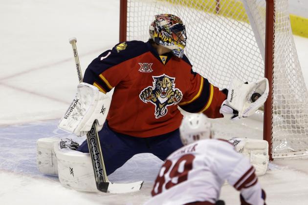 Florida Panthers goalie Roberto Luongo makes a save against Phoenix Coyotes left wing Mikkel Boedker (89), of Denmark, during the first period of an NHL hockey game, Tuesday, March 11, 2014, in Sunrise, Fla. (AP Photo/Wilfredo Lee)