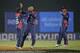Nepal bowler Shakti Gauchan, center, celebrates the dismissal of Hong Kong's Aizaz Khan during their ICC Twenty20 Cricket World Cup match in Chittagong, Bangladesh, Sunday, March 16, 2014. (AP Photo/Bikas Das)