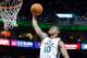 Mar 12, 2014; Salt Lake City, UT, USA; Utah Jazz guard Alec Burks (10) shoots against the Dallas Mavericks during the fourth quarter at EnergySolutions Arena. Mandatory Credit: Chris Nicoll-USA TODAY Sports