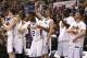 Mar 15, 2014; Katy, TX, USA; Stephen F. Austin Lumberjacks teammates celebrate during the final seconds of the game against the Sam Houston State Bearkats in the championship game for the Southland Conference college basketball tournament at Merrell Center. Stephen F. Austin Lumberjacks won 68-49. Mandatory Credit: Jim Cowsert-USA TODAY Sports