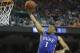Duke's Jabari Parker (1) drives past Virginia's London Perrantes (23) during the second half of an NCAA college basketball game in the championship of the Atlantic Coast Conference tournament in Greensboro, N.C., Sunday, March 16, 2014. (AP Photo/Gerry Broome)