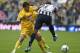 America´s Rubens Sambueza, left, fights for the ball with Monterrey's Lucas Silva at a Mexican soccer league match in Mexico City, Saturday, Sept. 7, 2013. (AP Photo/Christian Palma)