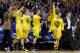 Mar 15, 2014; Indianapolis, IN, USA; Michigan Wolverines bench celebrates the victory after the game against the Ohio State Buckeyes in the semifinals of the Big Ten college basketball tournament at Bankers Life Fieldhouse. Michigan defeats Ohio State 72-69. Mandatory Credit: Brian Spurlock-USA TODAY Sports