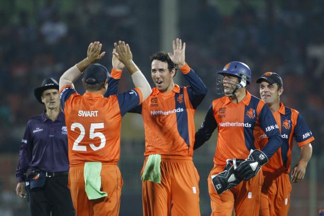 Netherlands bowler Ben Cooper, center, celebrate with his teammates the wicket of United Arab Emirates captain Khurram Khan during their ICC Twenty20 Cricket World Cup match in Sylhet, Bangladesh, Monday, March 17, 2014. (AP Photo/A.M. Ahad)