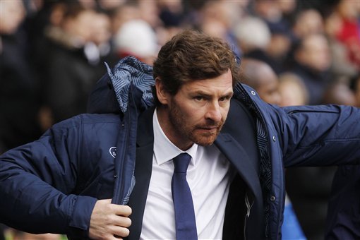 FILE - This is a Sunday, Dec. 1, 2013 file photo of Tottenham Hotspur's manager Andre Villas-Boas as he looks on from the dugout before the start of their English Premier League soccer match against Manchester United at White Hart Lane, London Tottenham manager Andre Villas-Boas has been fired by the Premier League club on Monday Dec. 16, 2013 a day after a 5-0 loss to Liverpool left the Portuguese coach under pressure. (AP Photo/Sang Tan, File)