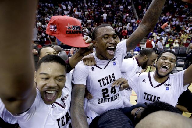 Texas Southern players Lawrence Johnson-Danner, left, Aaric Murray (24) and D'Angelo Scott, right, celebrate after beating Prairie View A&M in an NCAA college basketball game in the championship of the Southwestern Athletic Conference tournament Saturday, March 15, 2014, in Houston. Texas Southern won 78-73. (AP Photo/David J. Phillip)