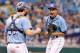 Jul 14, 2013; St. Petersburg, FL, USA; Tampa Bay Rays starting pitcher Chris Archer (22) reacts and is congratulated by catcher Jose Lobaton (59) after he threw a complete game shut out at Tropicana Field. Tampa Bay Rays defeated the Houston Astros 4-0. Mandatory Credit: Kim Klement-USA TODAY Sports