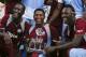 West Indies' Darren Sammy, left, Krishmar Santokie, center, and Andre Russell, pose with the trophy after beating England 2-1, in the series of three T20 International cricket matches at the Kensington Oval in Bridgetown, Barbados, Thursday, March 13, 2014. (AP Photo/Ricardo Mazalan)