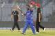 Afghanistan batsman Mohammad Shahzad acknowledges the crowd after scoring fifty runs during their ICC Twenty20 Cricket World Cup match against Hong Kong in Chittagong, Bangladesh, Tuesday, March 18, 2014 . (AP Photo/Bikas Das)