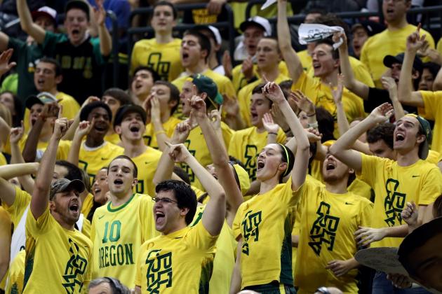 Members of the Oregon Pit Crew cheer on the Duck basketball team during their game against Arizona in an NCAA college basketball game in Eugene, Ore. on Saturday, March 8, 2014. (AP Photo/Chris Pietsch)