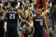 Jan. 02, 2014; Portland, OR, USA; Charlotte Bobcats point guard Kemba Walker (15) celebrates with center Al Jefferson (25) after scoring a basket during the third quarter of the game against the Portland Trail Blazers at the Moda Center. Mandatory Credit: Steve Dykes-USA TODAY Sports
