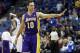 Los Angeles Lakers' Steve Nash waves to the Minnesota Timberwolves bench prior to an NBA basketball game, Tuesday, Feb. 4, 2014, in Minneapolis. The Timberwolves won 109-99. It was the first game back for Nash since early November as he recovered from a back injury. (AP Photo/Jim Mone)