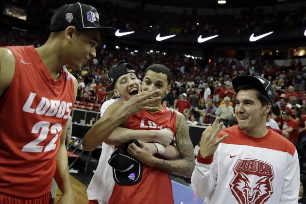 New Mexico's Kendall Williams, center front, celebrates with teammates after winning an NCAA college basketball game against San Diego State for the Mountain West Conference tournament championship on Saturday, March 15, 2014, in Las Vegas. New Mexico defeated San Diego State 64-58. (AP Photo/Isaac Brekken)
