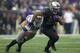 SEATTLE, WA - NOVEMBER 29: Bishop Sankey #25 of Washington rushes the ball as Tana Pritchard #33 of Washington State tries to make a tackle during the second half of a game at Husky Stadium on November 29, 2013 in Seattle, Washington. Washington won the game 27-17. Sankey broke the University of Washington all-time record for rushing touchdowns and total rushing yardage. (Photo by Stephen Brashear/Getty Images)
