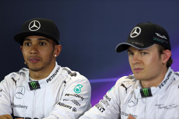 MELBOURNE, AUSTRALIA - MARCH 15: First placed Lewis Hamilton (L) of Great Britain and Mercedes GP and third placed Nico Rosberg (R) of Germany and Mercedes GP attend the official press conference following qualifying for the Australian Formula One Grand Prix at Albert Park on March 15, 2014 in Melbourne, Australia. (Photo by Mark Thompson/Getty Images)