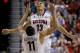 Arizona's Nick Johnson (13) reacts with Aaron Gordon after hitting a 3-point basket against Colorado during the first half of an NCAA college basketball game in the semifinals of the Pac-12 Conference on Friday, March 14, 2014, in Las Vegas. (AP Photo/Julie Jacobson)