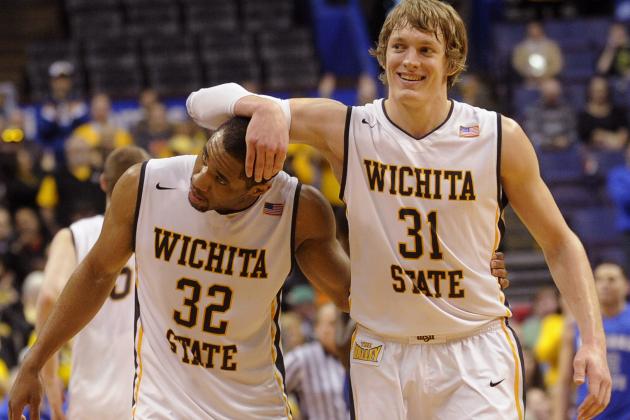 Wichita State's Ron Baker (31) and Tekele Cotton (32) celebrate late in the second half of an NCAA college basketball game against Indiana State for the championship of the Missouri Valley Conference Sunday, March 9, 2014, in St. Louis. (AP Photo/Bill Boyce)