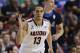 Arizona's Nick Johnson holds up three fingers after hitting a three point basket against UCLA in the second half during the championship game of the NCAA Pac-12 conference college basketball tournament, Saturday, March 15, 2014, in Las Vegas. (AP Photo/Julie Jacobson)