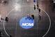 Donald Patrick, left, of Davidson College in Davidson, N.C., works with his coach, Brandon Sinnott, right, on a wrestling mat in Oklahoma City, Wednesday, March 19, 2014, in preparation for the NCAA college wrestling championships. Competition begins March 20. (AP Photo/Sue Ogrocki)