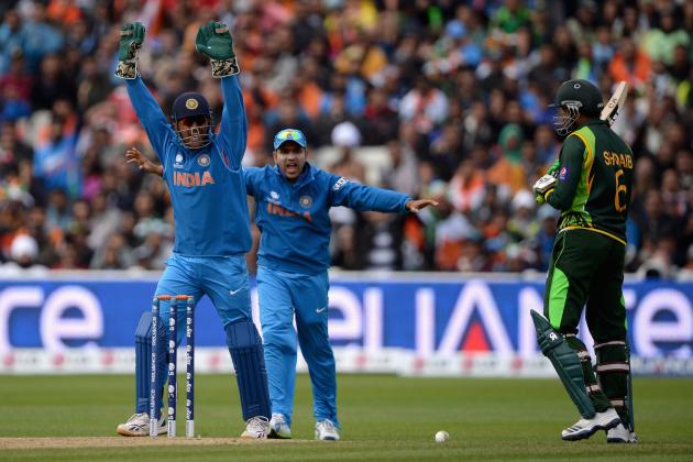 BIRMINGHAM, ENGLAND - JUNE 15:  India captain MS Dhoni celebrates the dismissal of Shoaib Malik of Pakistan during the ICC Champions Trophy match between India and Pakiatan at Edgbaston on June 15, 2013 in Birmingham, England.  (Photo by Gareth Copley/Getty Images)