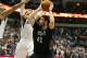 Mar 19, 2014; Dallas, TX, USA; Minnesota Timberwolves forward Kevin Love (42) splits a boucle team in overtime against Dallas Mavericks forward Shawn Marion (0) and guard Devin Harris (20) at American Airlines Center. The Timberwolves beat the Mavs 123-122 in overtime. Mandatory Credit: Matthew Emmons-USA TODAY Sports