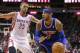 Jan 3, 2014; Houston, TX, USA; New York Knicks small forward Carmelo Anthony (7) drives the ball during the fourth quarter as Houston Rockets small forward Chandler Parsons (25) defends at Toyota Center. The Rockets defeated the Knicks 102-100. Mandatory Credit: Troy Taormina-USA TODAY Sports
