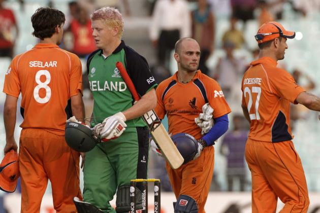 Ireland's Kevin O'Brien, second form left, shakes hand with Netherlands' cricketers after winning the game by six wickets during a Cricket World Cup match between Ireland and Netherlands in Calcutta, India, Friday, March 18, 2011. (AP Photo/Bikas Das)