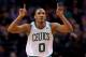 Mar 19, 2014; Boston, MA, USA; Boston Celtics guard Avery Bradley (0) celebrates after scoring during the third quarter against the Miami Heat at TD Garden. Mandatory Credit: Greg M. Cooper-USA TODAY Sports