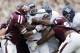 Rice's Charles Ross, center, is hit by Texas A&M defenders Tommy Sanders, left, and Isaiah Golden, right, as he works to cross the goal line for a touchdown during the fourth quarter of an NCAA college football game, Saturday, Aug. 31, 2013, in College Station, Texas. (AP Photo/Eric Gay)