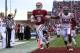 Oklahoma quarterback Trevor Knight (9) runs in for a touchdown in front of Iowa State's Jeremiah George (52) in the third quarter of an NCAA college football game in Norman, Okla. on Saturday, Nov. 16, 2013. (AP Photo/Alonzo Adams)