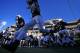 FILE - In this Sept. 14, 2013, file photo, the Penn State football team runs onto the field at Beaver Stadium before an NCAA college football game against UCF in State College, Pa. Penn State will gradually get back football scholarships taken away over the Jerry Sandusky child molestation scandal, the NCAA announced Tuesday, Sept. 24, 2013, crediting the university for making significant improvements to its athletics programs. (AP Photo/Gene J. Puskar, File)