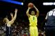 Mar 20, 2014; Milwaukee, WI, USA; Oregon Ducks guard Joseph Young (3) shoots a jump shot over Brigham Young Cougars guard Tyler Haws (3) during the second round of the 2014 NCAA Tournament at BMO Harris Bradley Center. Mandatory Credit: Jeff Hanisch-USA TODAY Sports
