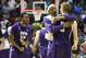 Stephen F. Austin forward Ben Brown-White, second from right, hugs teammate guard Thomas Walkup, right, after defeating Virginia Commonwealth 77-75 in overtime in a second-round game in the NCAA college basketball tournament Friday, March 21, 2014, in San Diego. (AP Photo/Denis Poroy)