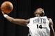CHARLOTTE, NC - OCTOBER 23: Michael Kidd-Gilchrist #14 of the Charlotte Bobcats dunks during the open practice at the Time Warner Cable Arena on October 23, 2013 in Charlotte, North Carolina. NOTE TO USER: User expressly acknowledges and agrees that, by downloading and or using this photograph, User is consenting to the terms and conditions of the Getty Images License Agreement. Mandatory Copyright Notice: Copyright 2013 NBAE (Photo by Brock Williams-Smith/NBAE via Getty Images)